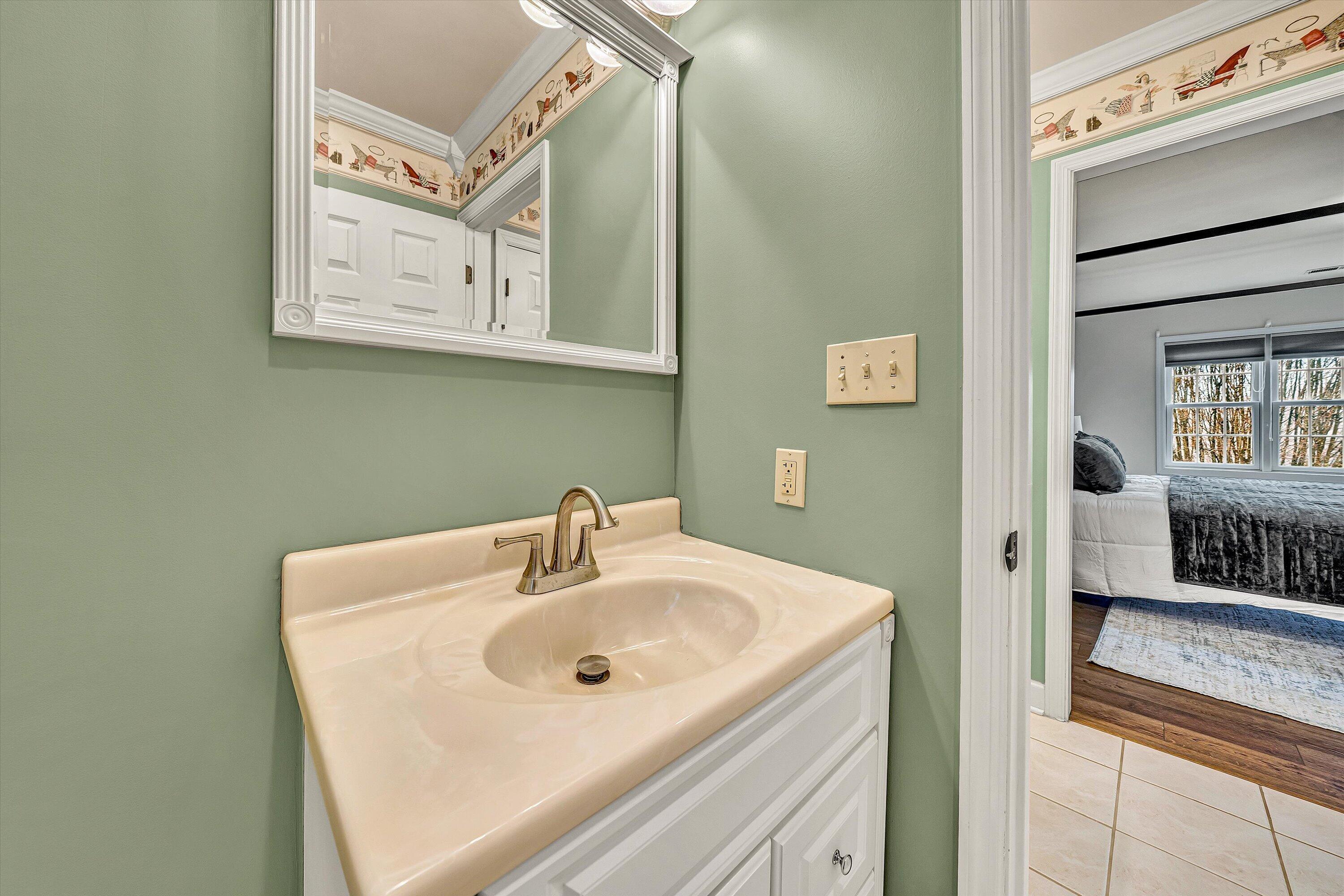 116 Dustys Road Covington, VA 24426 - Photo 54 of 96 a bathroom with a sink and a mirror
