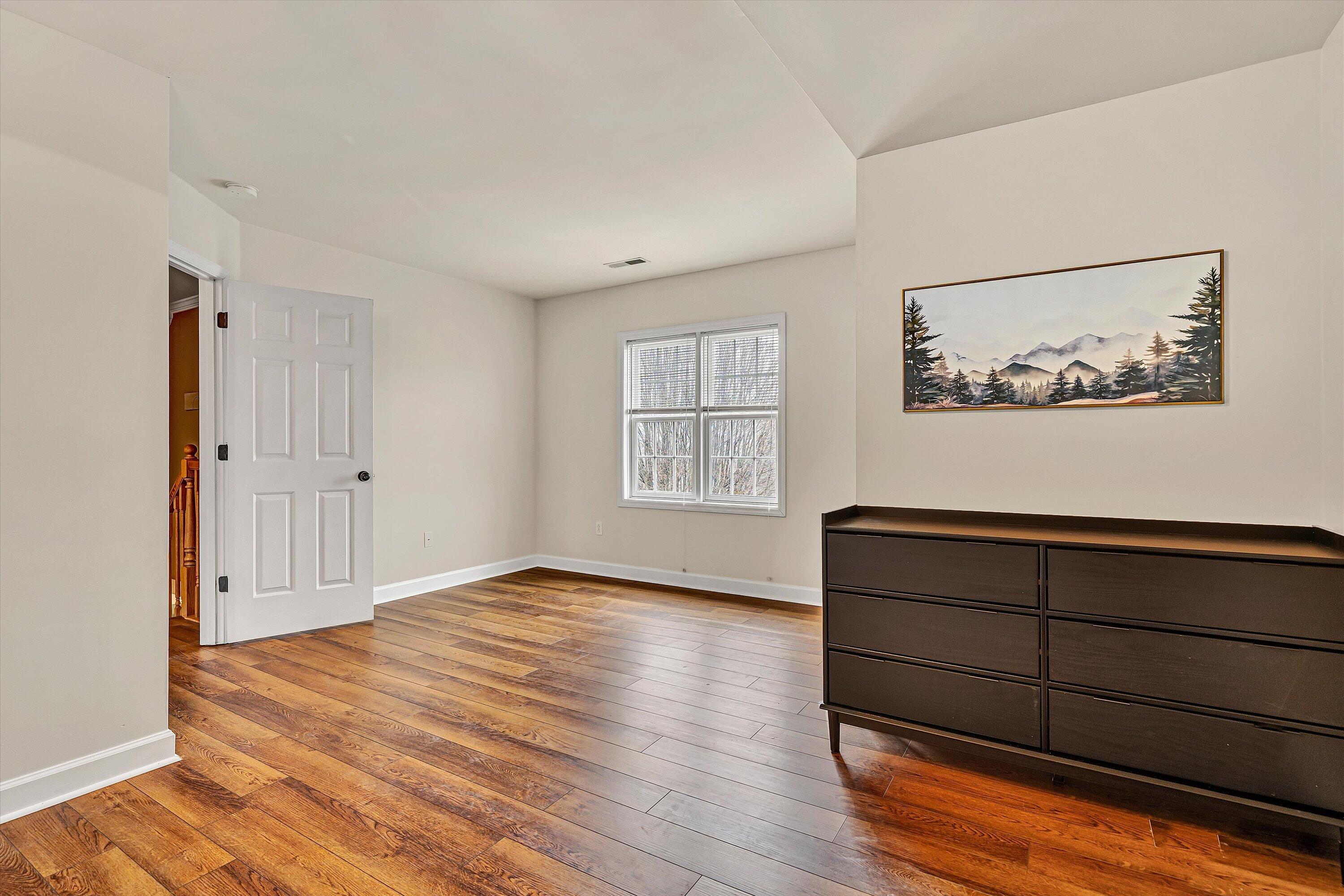 116 Dustys Road Covington, VA 24426 - Photo 59 of 96 a view of an empty room with wooden floor and a window