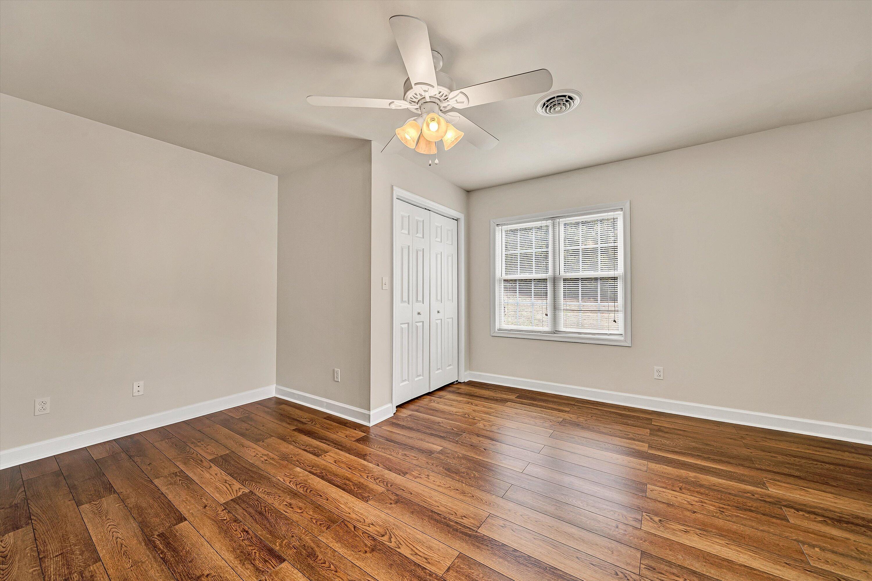 116 Dustys Road Covington, VA 24426 - Photo 68 of 96 a view of an empty room with wooden floor and a window