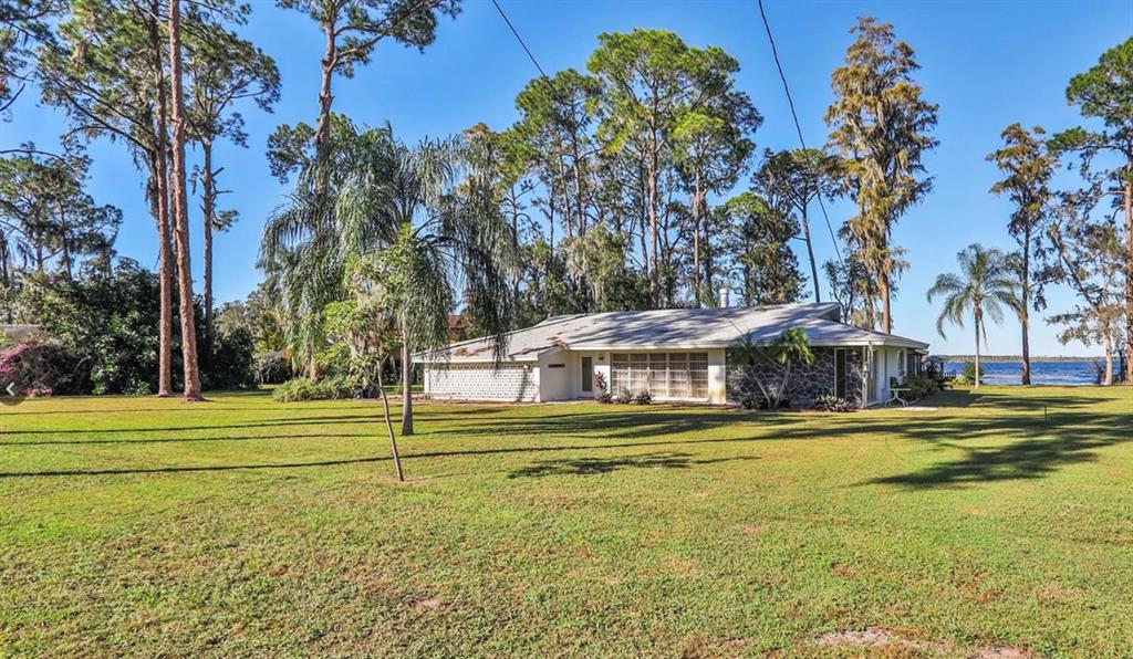 a view of a swimming pool with an outdoor space and seating area