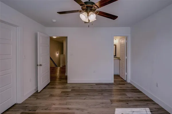 a view of room with wooden floor