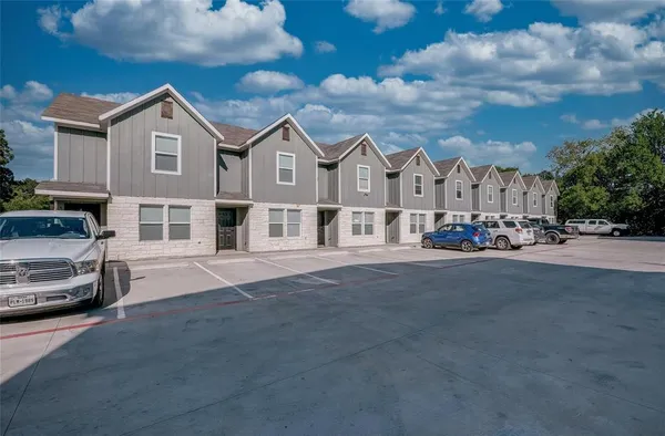 a view of a car park in front of house