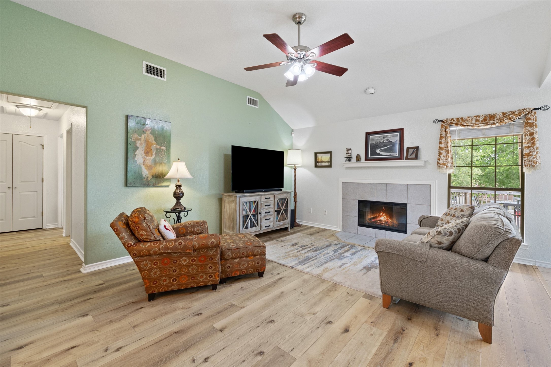 135 Barton Road San Marcos, TX 78666 - Photo 17 of 29 Living room with a cozy fireplace