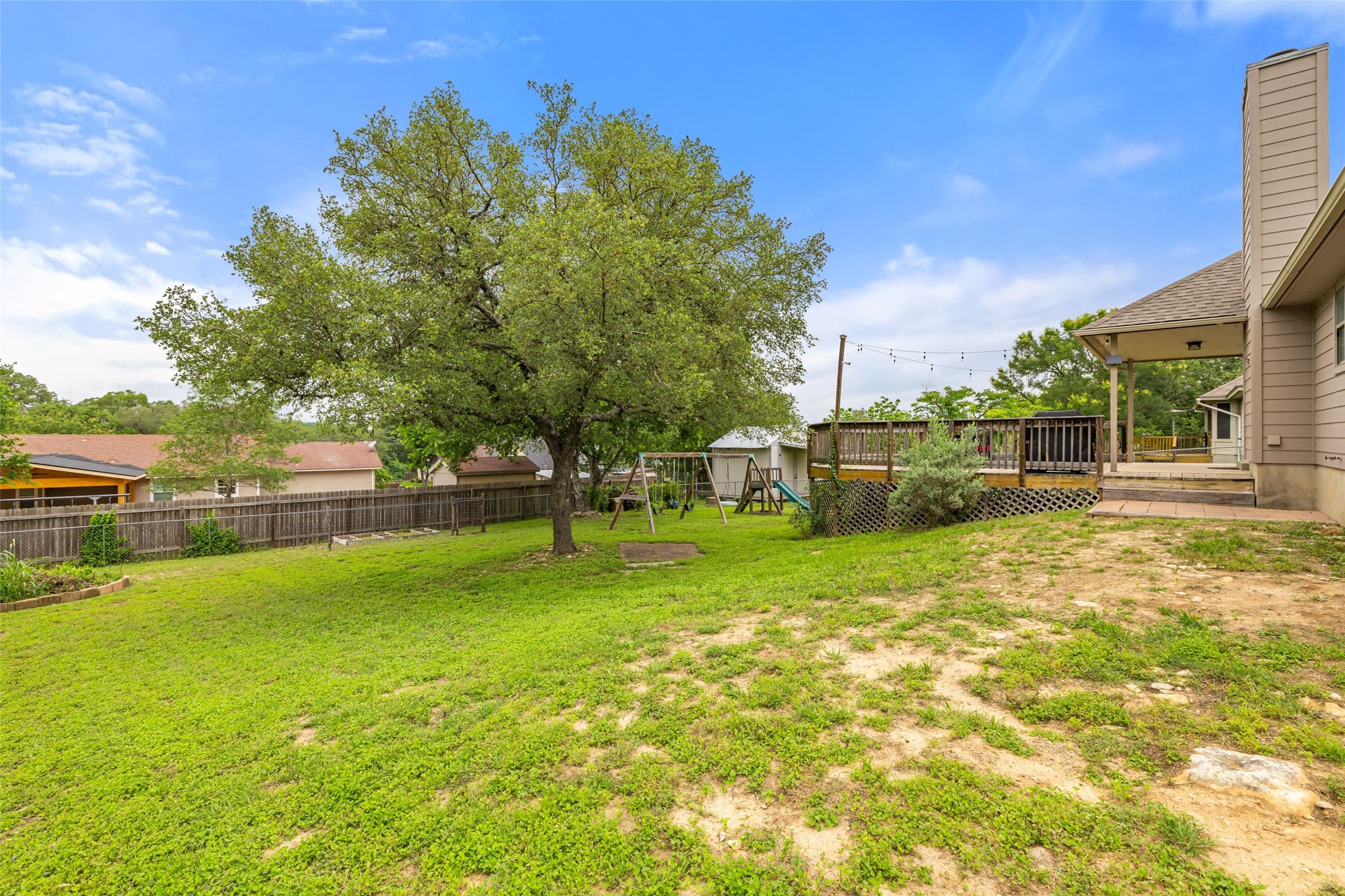 135 Barton Road San Marcos, TX 78666 - Photo 29 of 29 Landscaped backyard with dedicated space for gardening