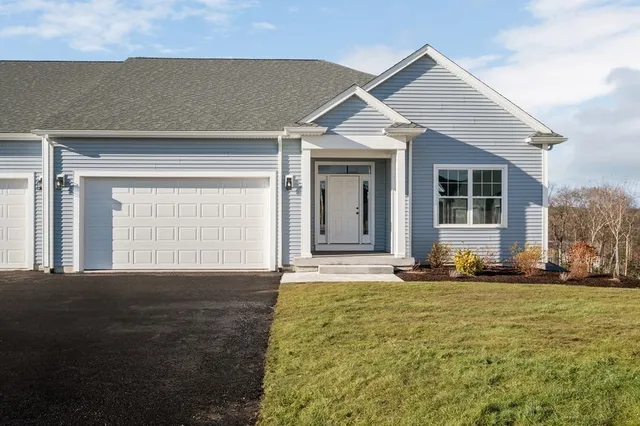 a front view of a house with a yard