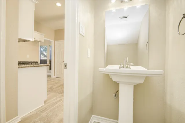 a bathroom with a sink and mirror