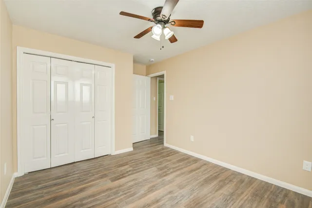 a view of a livingroom with a chandelier fan