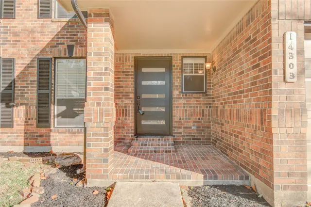 a view of a brick buildings with windows