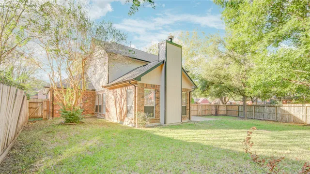 a view of a yard with a tree