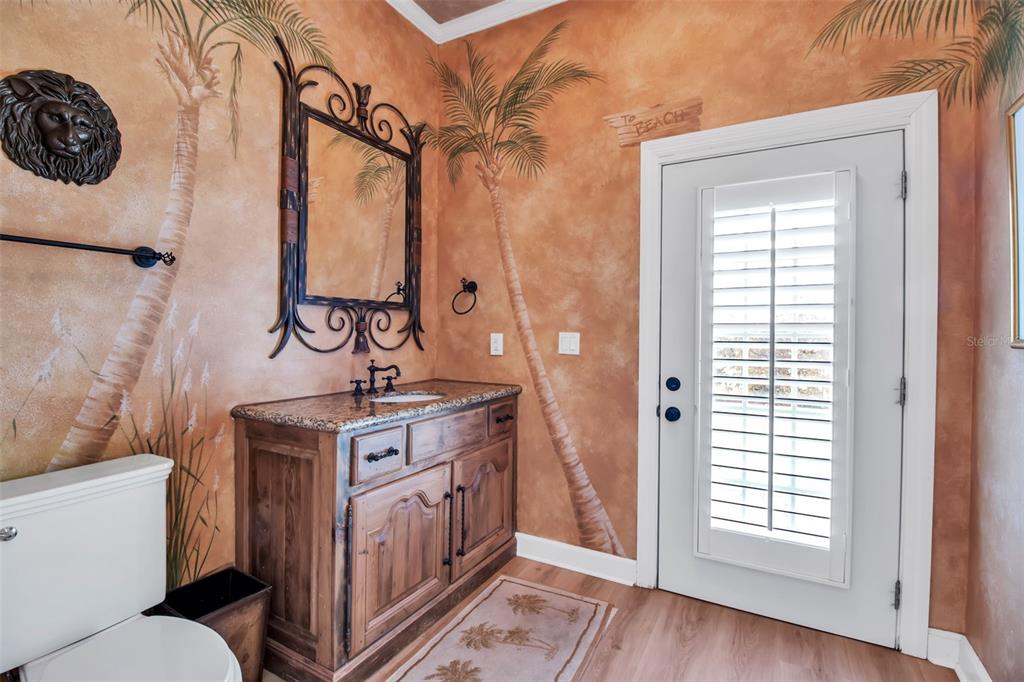 401 Walls Way Osprey, FL 34229 - Photo 19 of 51 a bathroom with a sink a toilet and a window