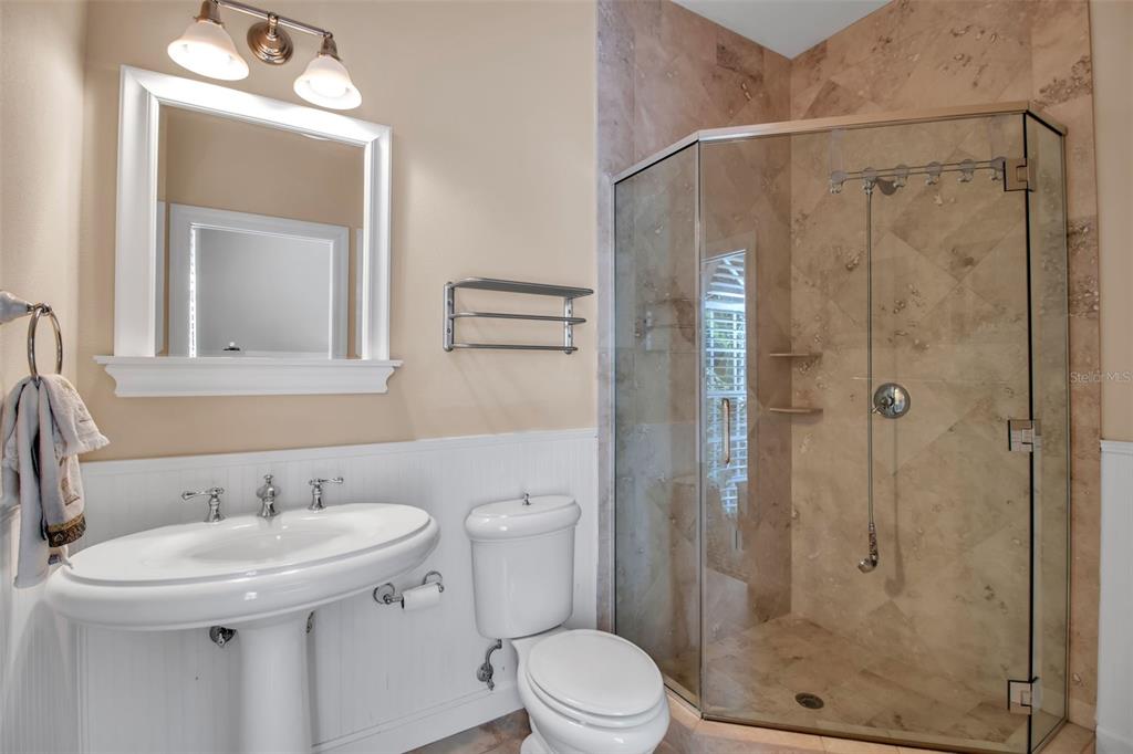 401 Walls Way Osprey, FL 34229 - Photo 22 of 51 a bathroom with a sink toilet and shower