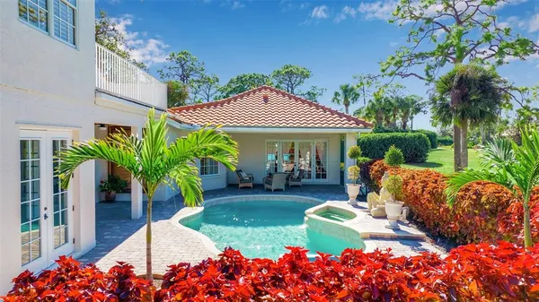 a view of a swimming pool with a yard