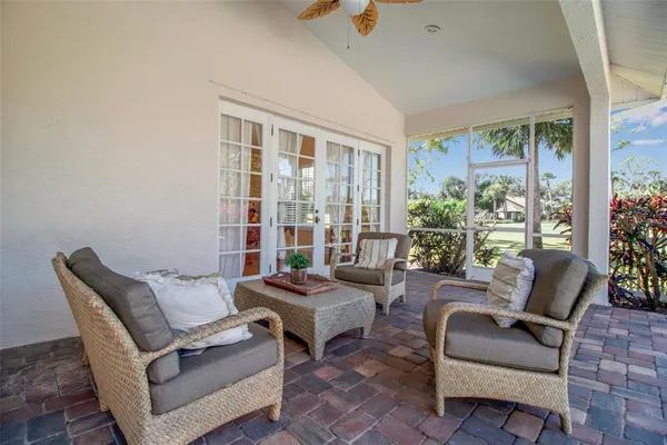 a front view of a house with a yard and potted plants