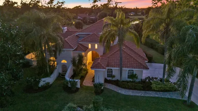 an aerial view of house with yard swimming pool and outdoor seating