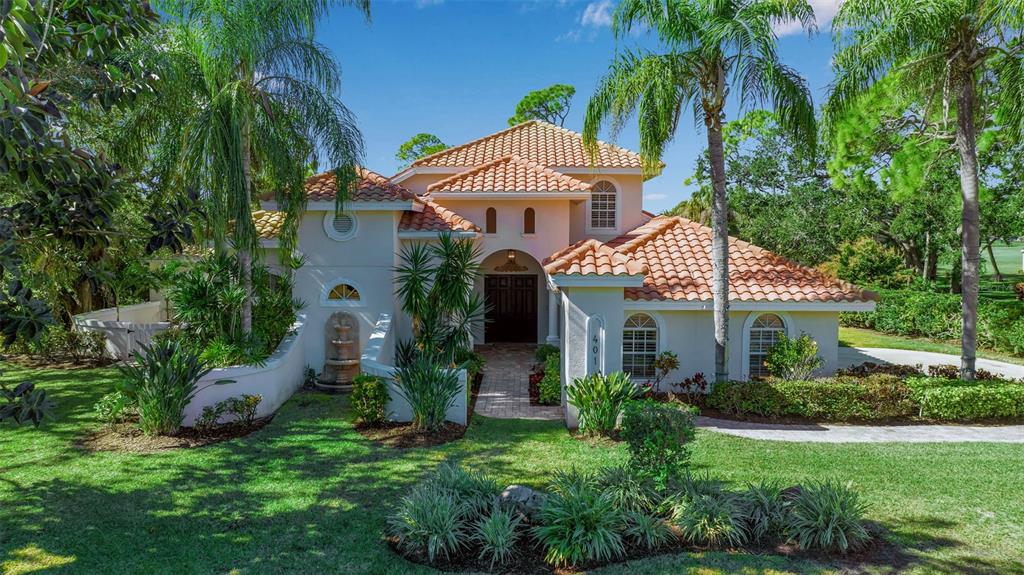 401 Walls Way Osprey, FL 34229 - Photo 37 of 51 a front view of a house with a garden
