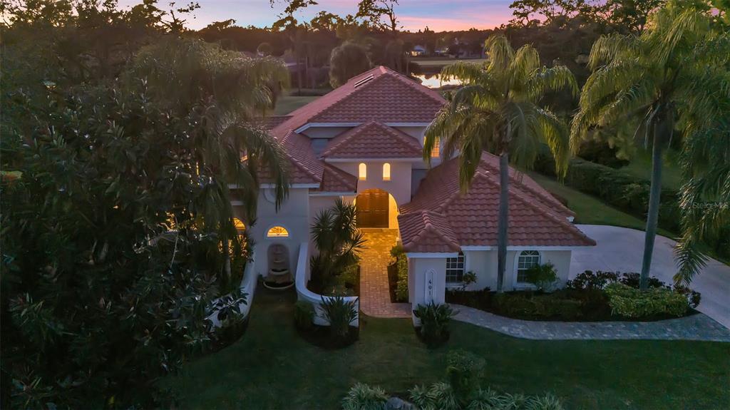 401 Walls Way Osprey, FL 34229 - Photo 49 of 51 a front view of house with yard and green space