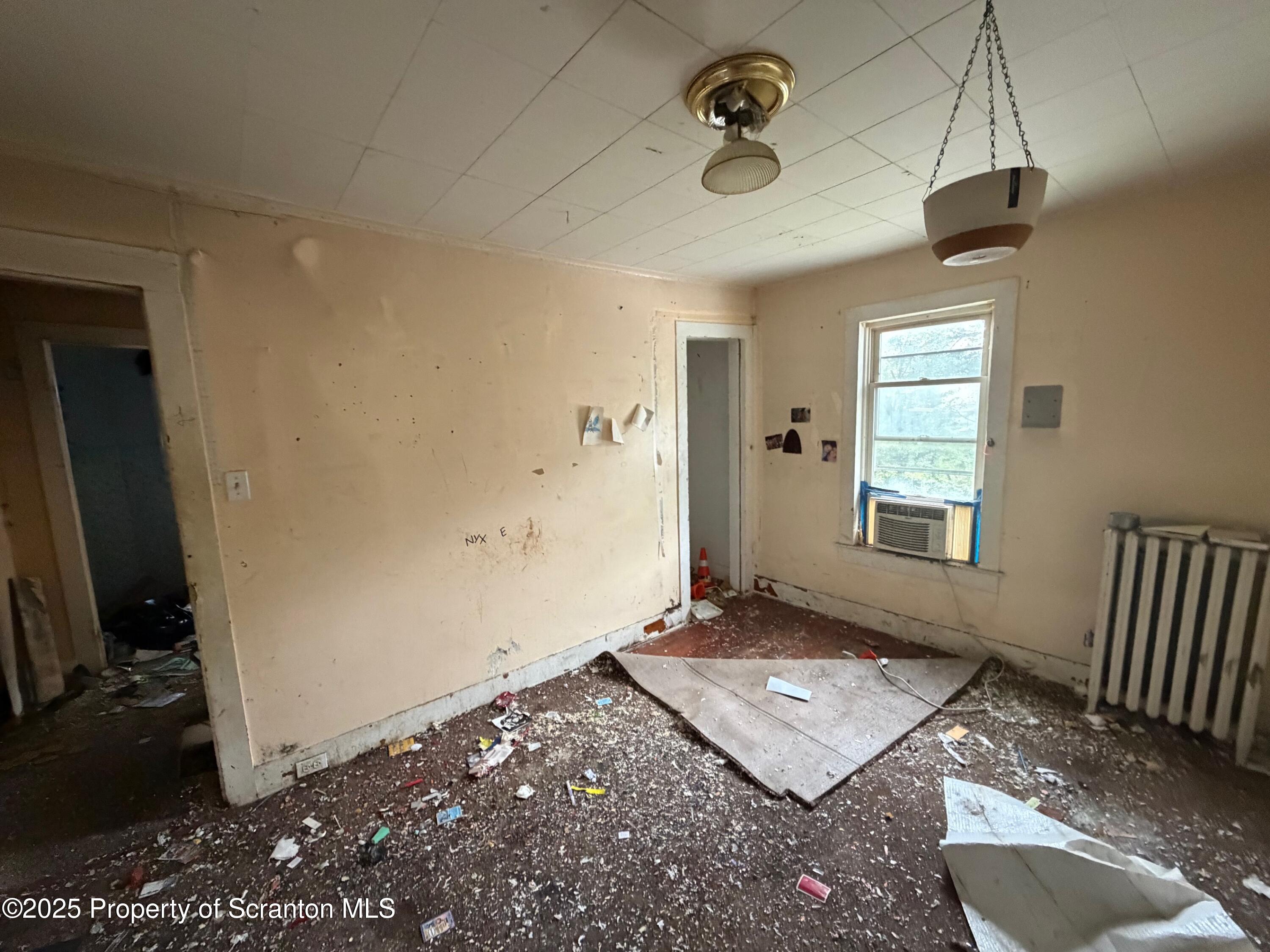 60 Mill Street Pittston, PA 18640 - Photo 27 of 33 a living room with hard wood floor and a window