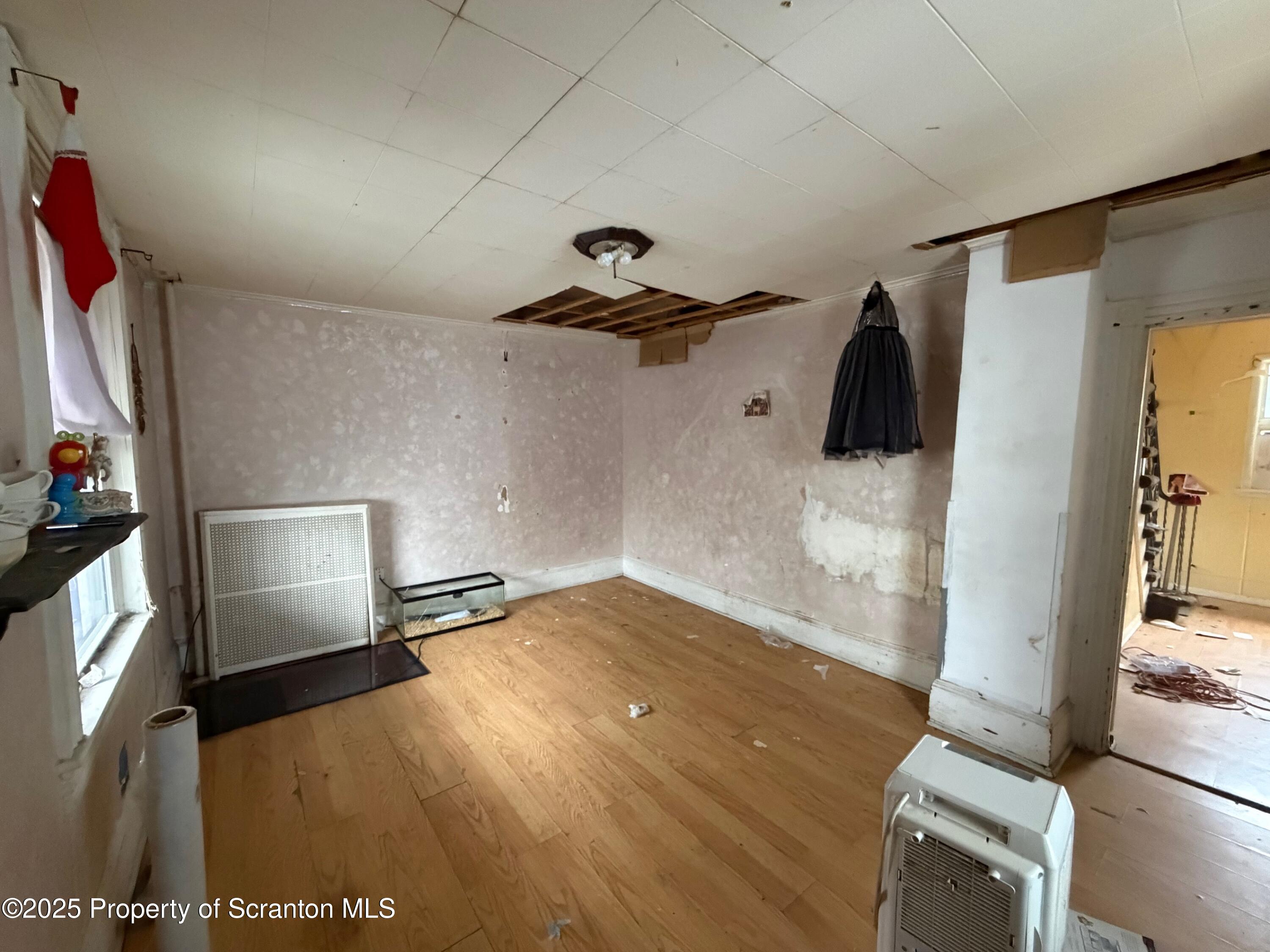 60 Mill Street Pittston, PA 18640 - Photo 31 of 33 a view of empty room with wooden floor