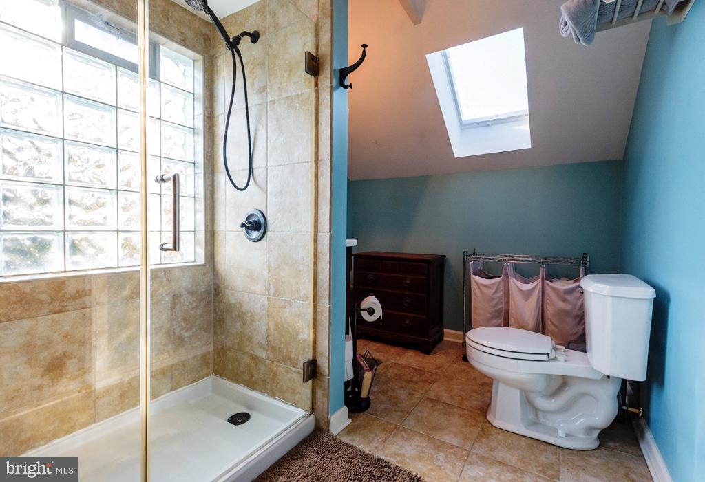 3504 Georgetown Road Baltimore, MD 21227 - Photo 27 of 28 Large shower with block glass for plenty of light