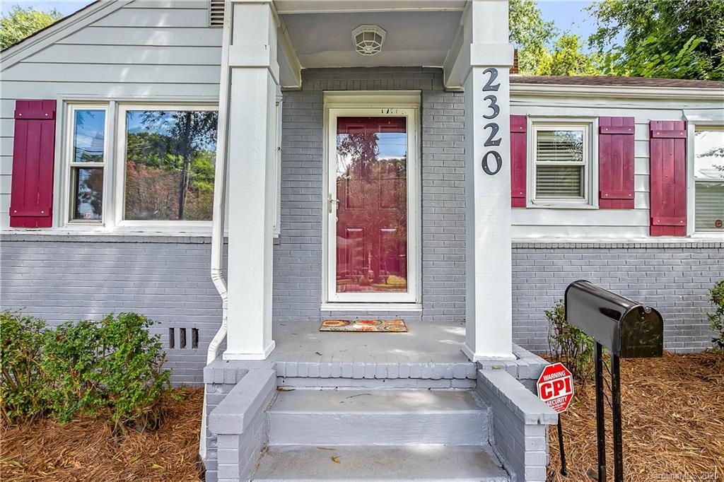 2320 Vanderbilt Road Charlotte, NC 28206 - Photo 11 of 11 a front view of a house with parking