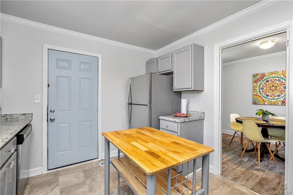 2320 Vanderbilt Road Charlotte, NC 28206 - Photo 5 of 11 a kitchen with a table and chairs in it