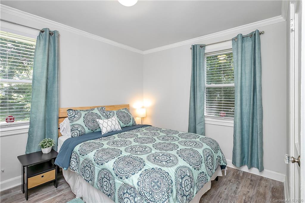 2320 Vanderbilt Road Charlotte, NC 28206 - Photo 7 of 11 a bedroom with a bed and a window