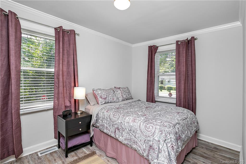 2320 Vanderbilt Road Charlotte, NC 28206 - Photo 8 of 11 a bedroom with a bed and a window