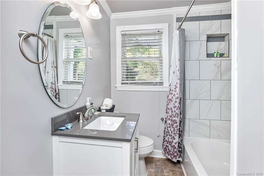 2320 Vanderbilt Road Charlotte, NC 28206 - Photo 9 of 11 a bathroom with a sink toilet and shower