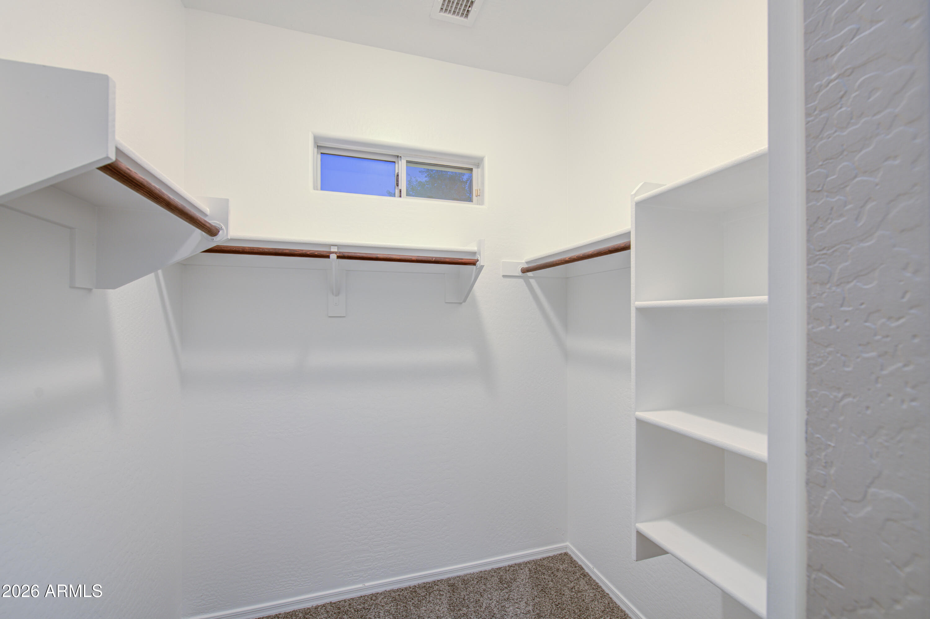 7759 West Monte Vista Road Phoenix, AZ 85035 - Photo 25 of 43 a view of an empty walk in closet