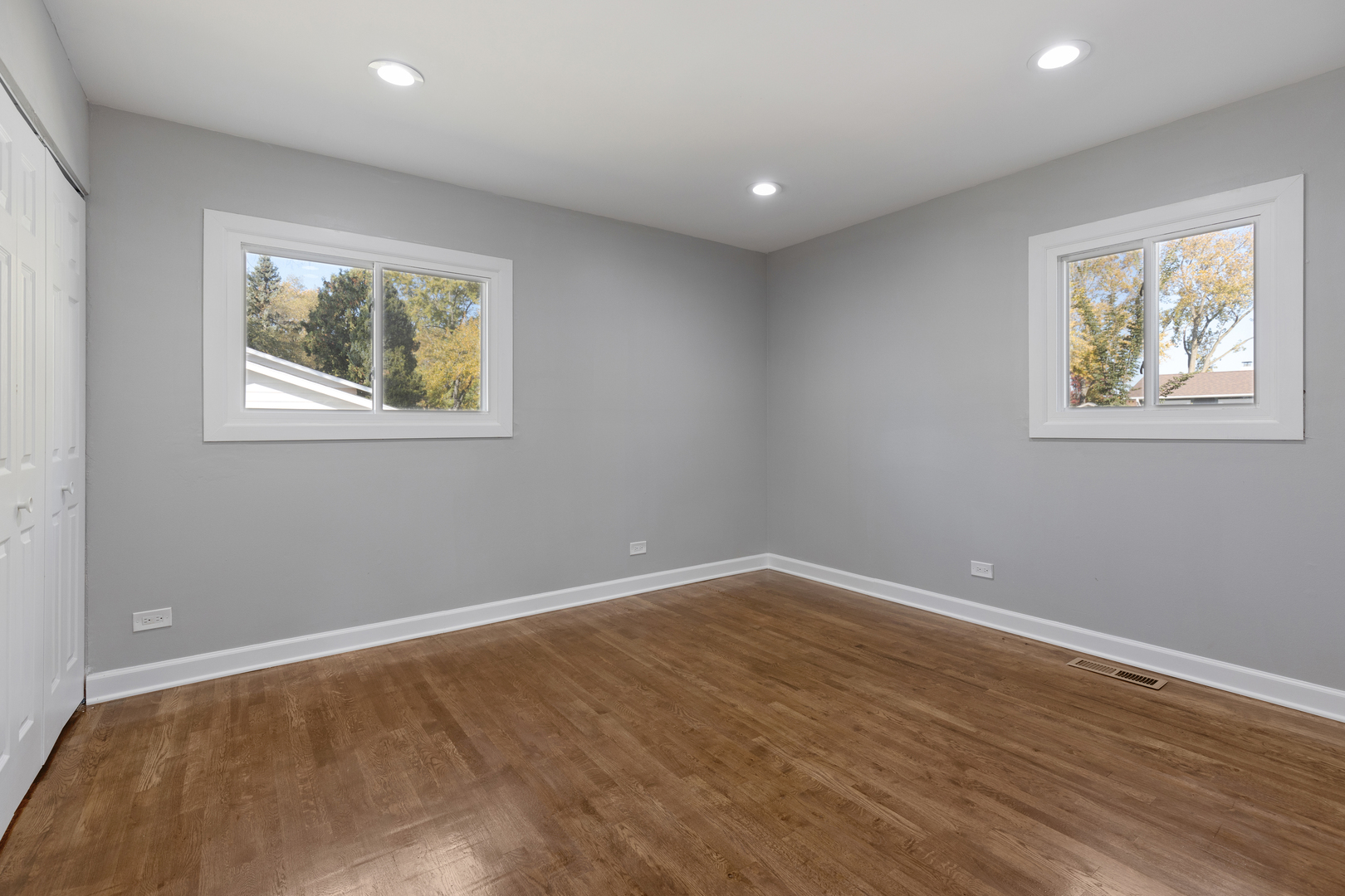 960 Olive Street Hoffman Estates, IL 60169 - Photo 11 of 22 a view of an empty room with wooden floor and a window