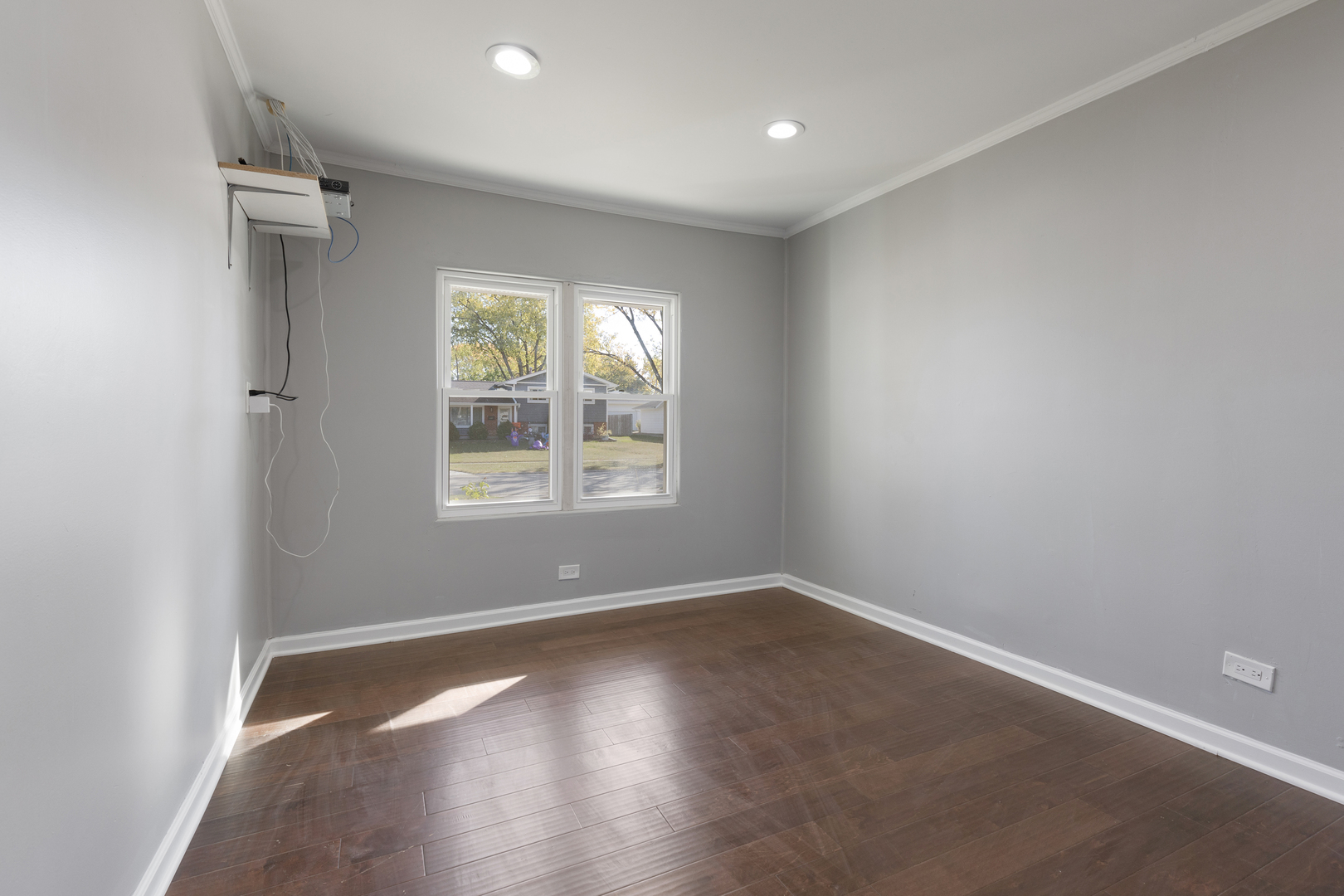 960 Olive Street Hoffman Estates, IL 60169 - Photo 9 of 22 an empty room with wooden floor and windows