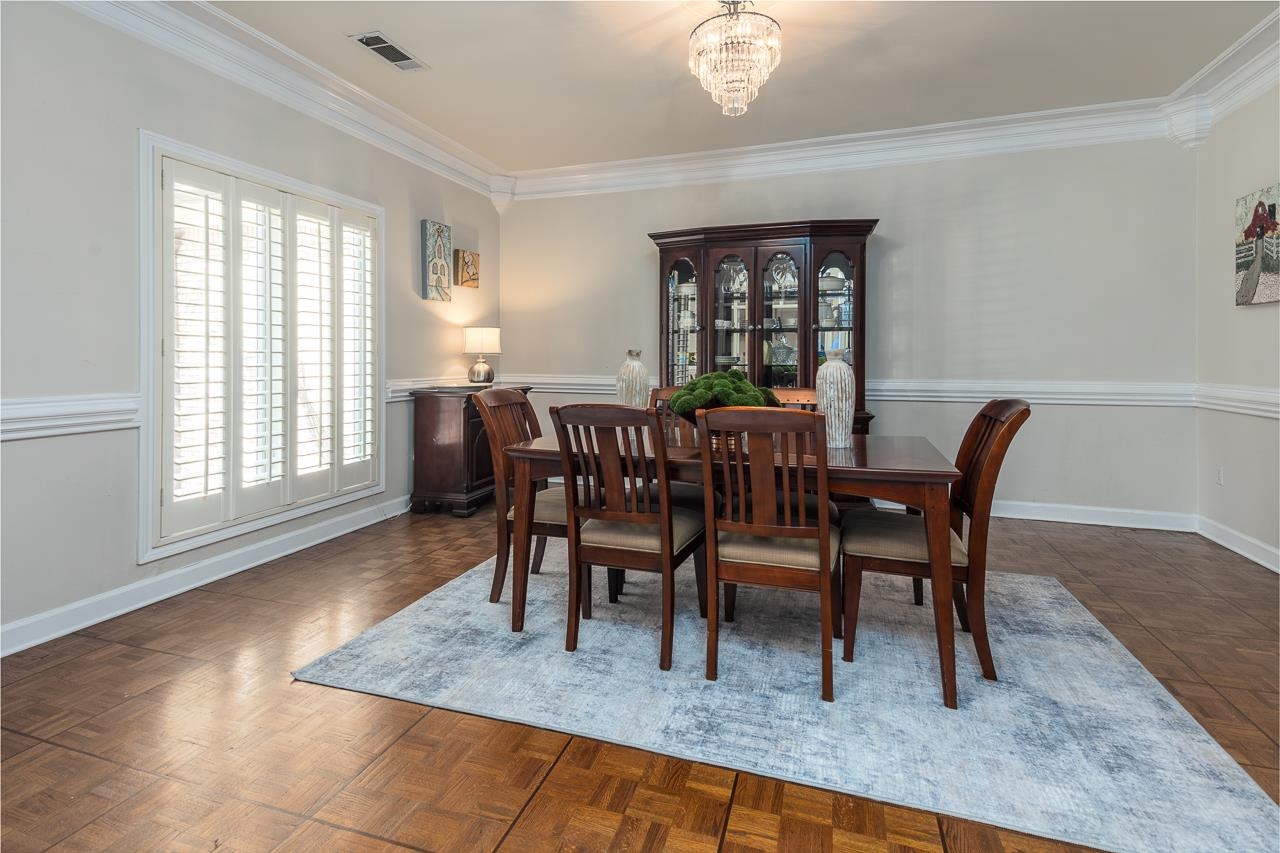 9637 Spring Meade Lane Germantown, TN 38139 - Photo 11 of 25 a view of a dining room with furniture window and wooden floor