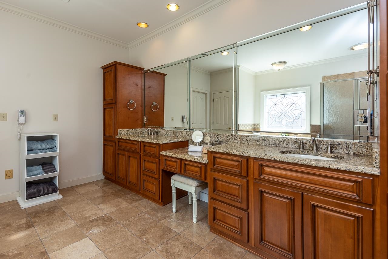 9637 Spring Meade Lane Germantown, TN 38139 - Photo 14 of 25 a bathroom with a granite countertop sink and a mirror