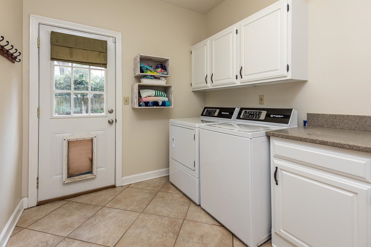 9637 Spring Meade Lane Germantown, TN 38139 - Photo 16 of 25 a kitchen with granite countertop white cabinets and white appliances