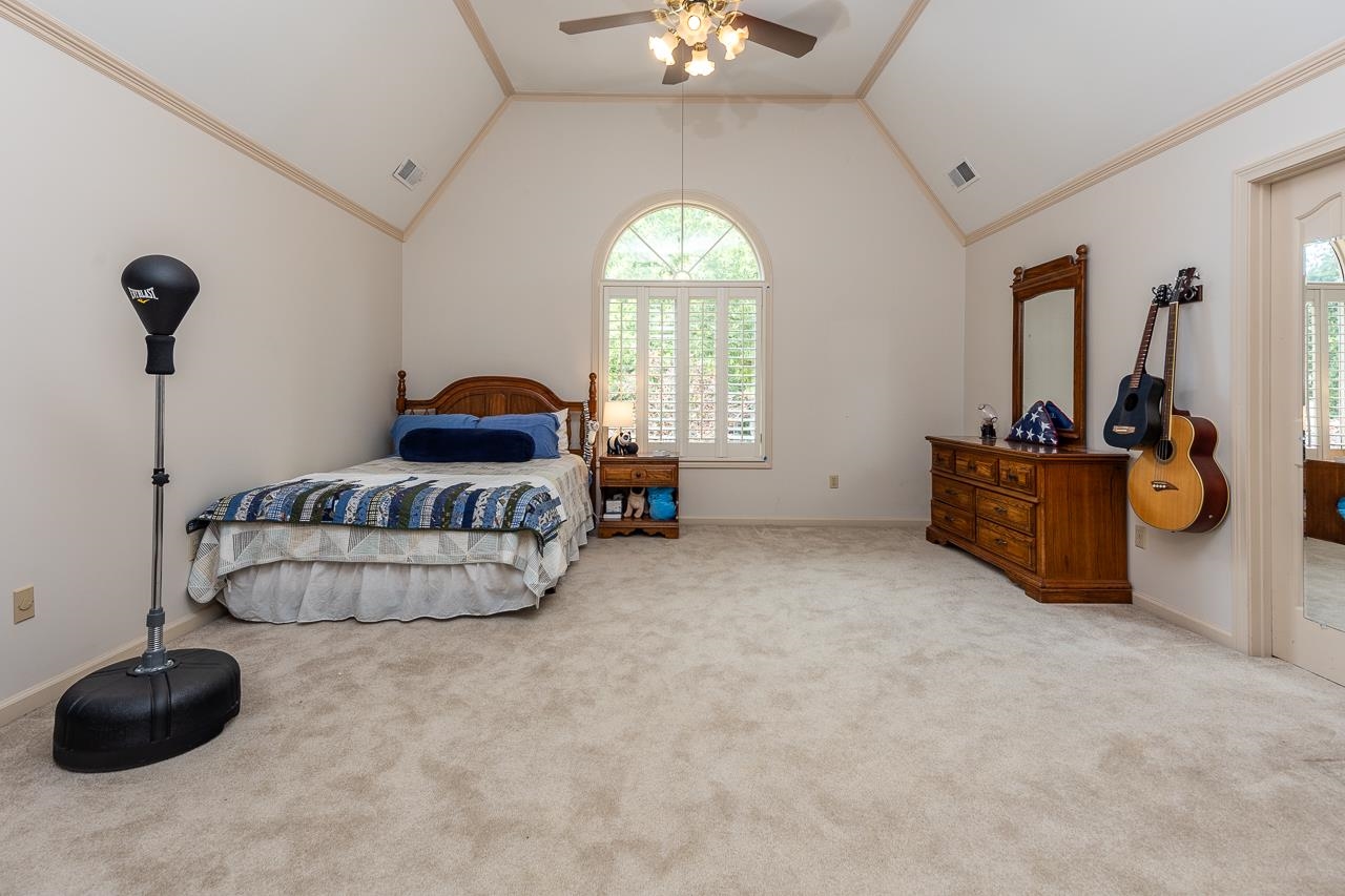 9637 Spring Meade Lane Germantown, TN 38139 - Photo 19 of 25 a living room with furniture and a chandelier