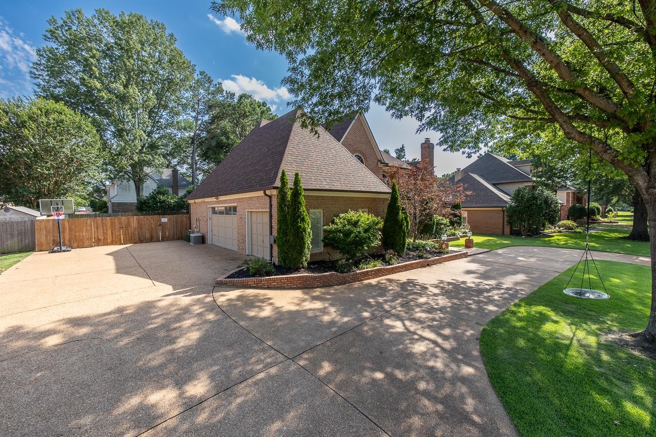 9637 Spring Meade Lane Germantown, TN 38139 - Photo 25 of 25 a house with a tree in front of it