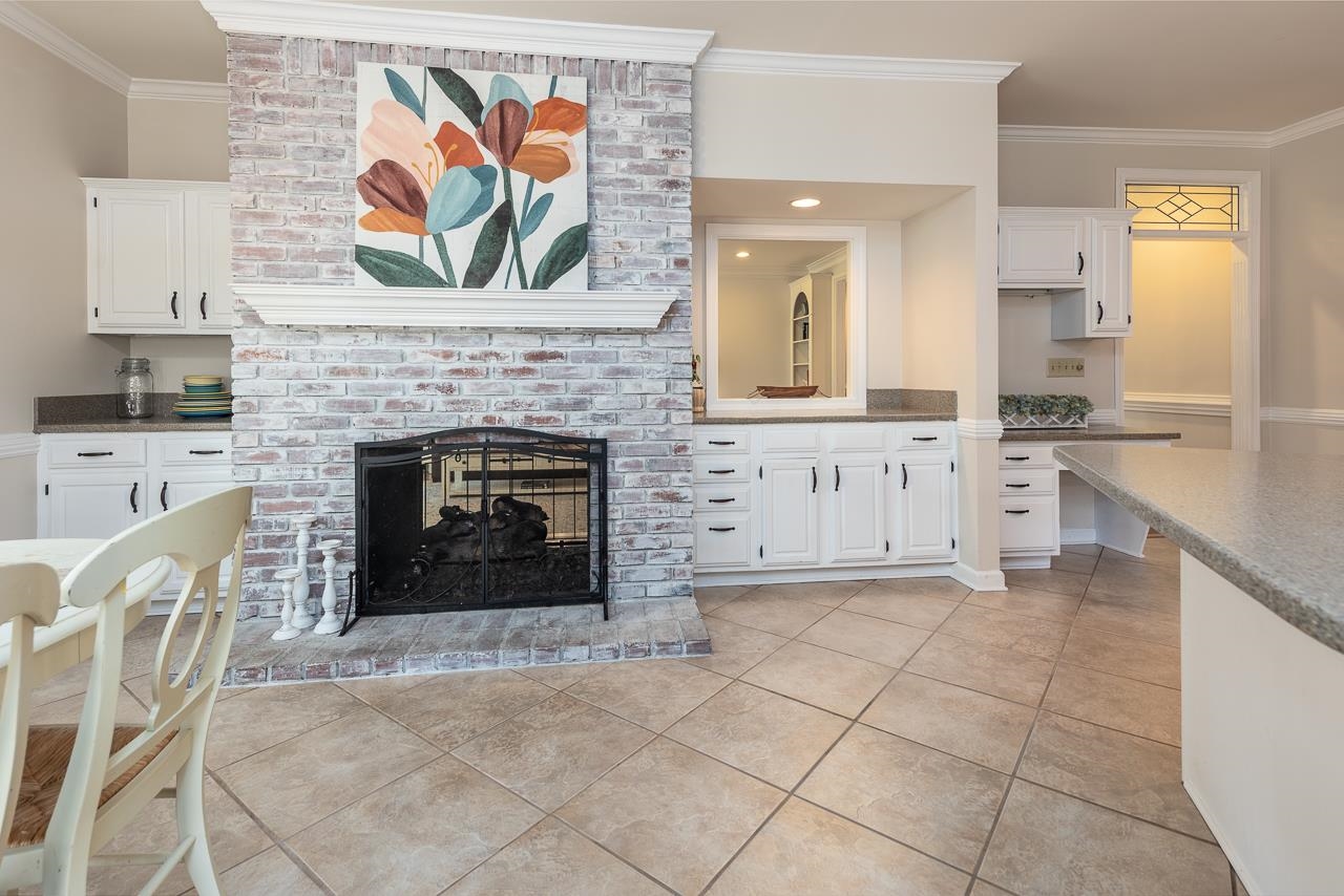 9637 Spring Meade Lane Germantown, TN 38139 - Photo 8 of 25 a view of a kitchen with furniture and fireplace