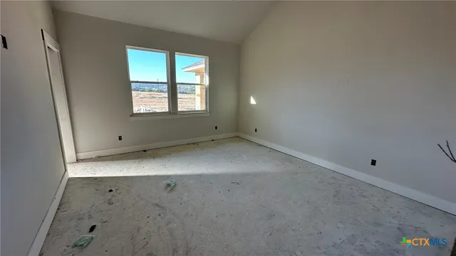 an empty room with windows