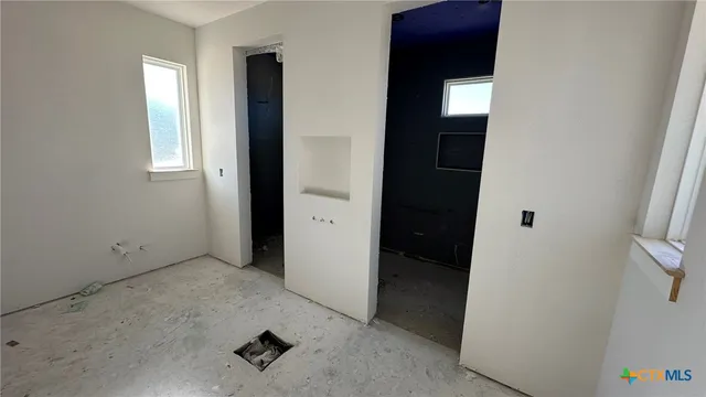 an empty room with windows