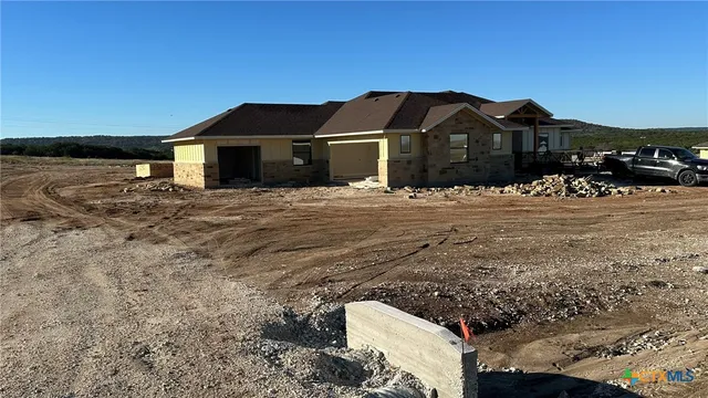a view of a house next to a yard