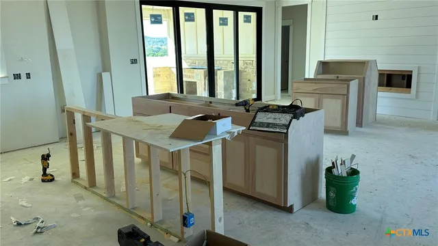a utility room with multiple dryer and washer