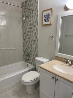a bathroom with a sink a toilet and a bathtub