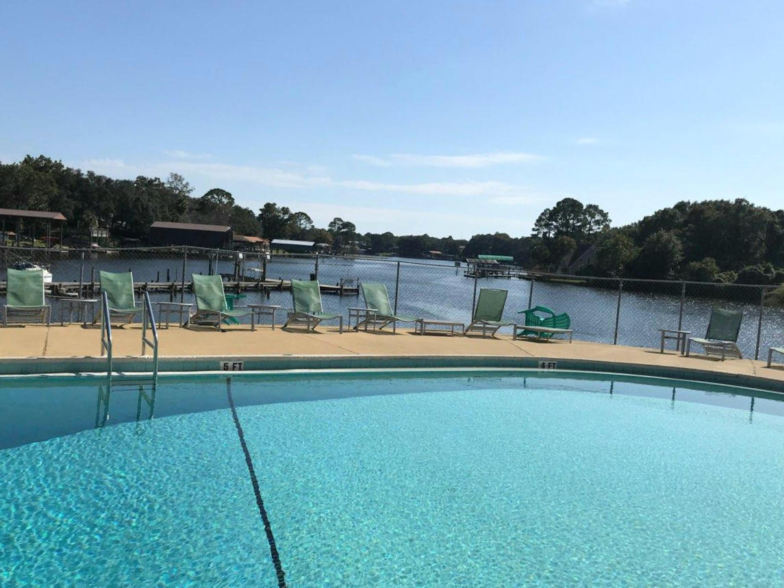 210 Pelham Road, Unit 108C Fort Walton Beach, FL 32547 - Photo 1 of 8 a view of lake with mountain