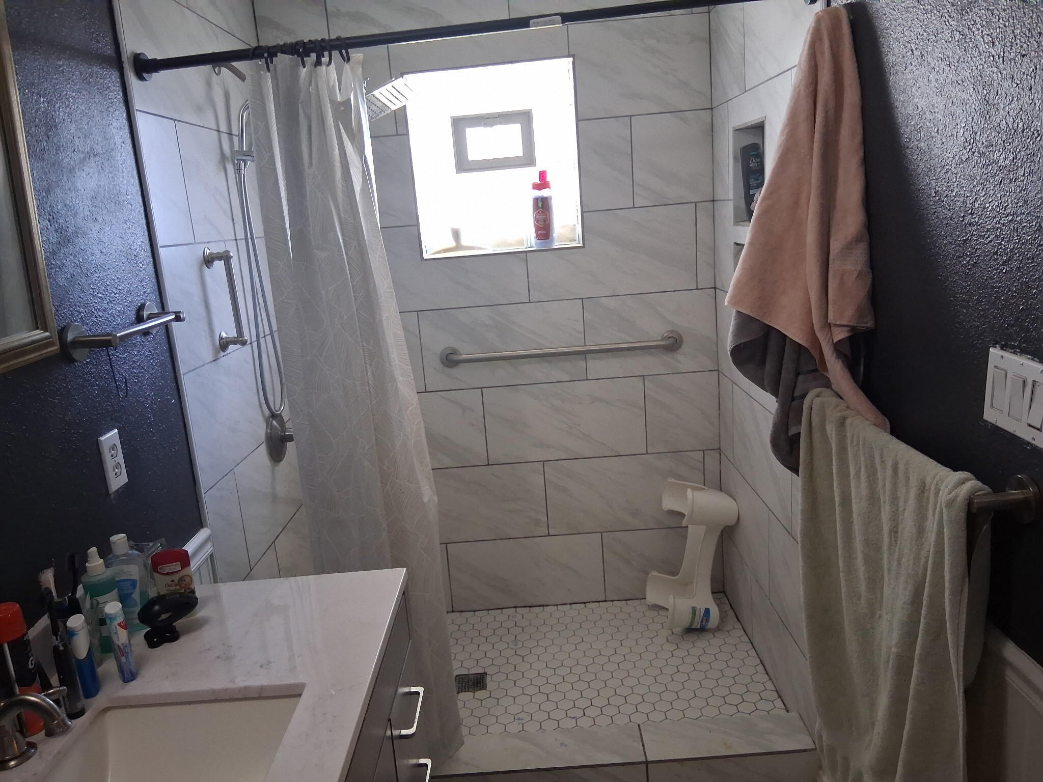 4807 Penrose Avenue Fort Worth, TX 76116 - Photo 8 of 12 a bathroom with a sink a toilet and a shower