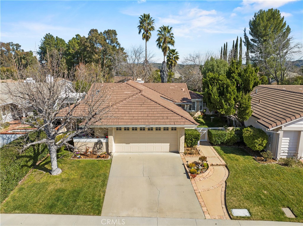 25624 Rancho Adobe Road Valencia, CA 91355 - Photo 1 of 1 a view of a house with a yard