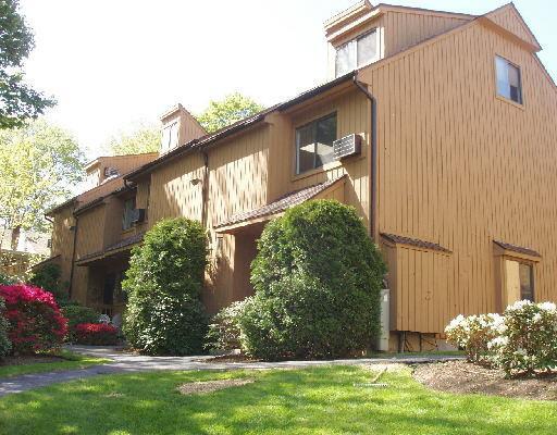 19 Woodway Road, Unit 19 Stamford, CT 06907 - Photo 1 of 1 a front view of a house having yard