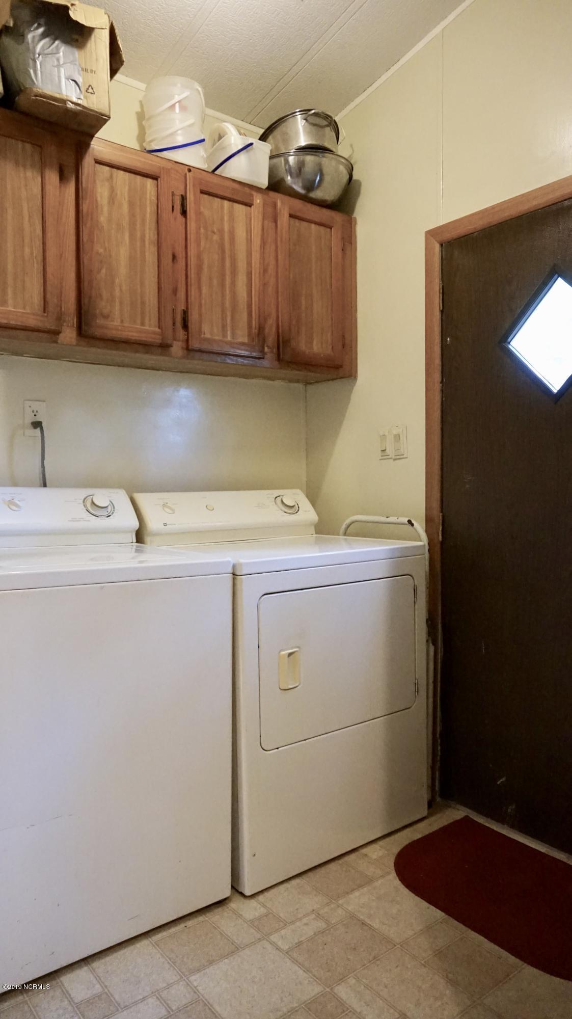 410 Sand Ridge Road New Bern, NC 28560 - Photo 11 of 20 Laundry Room with Exterior Door