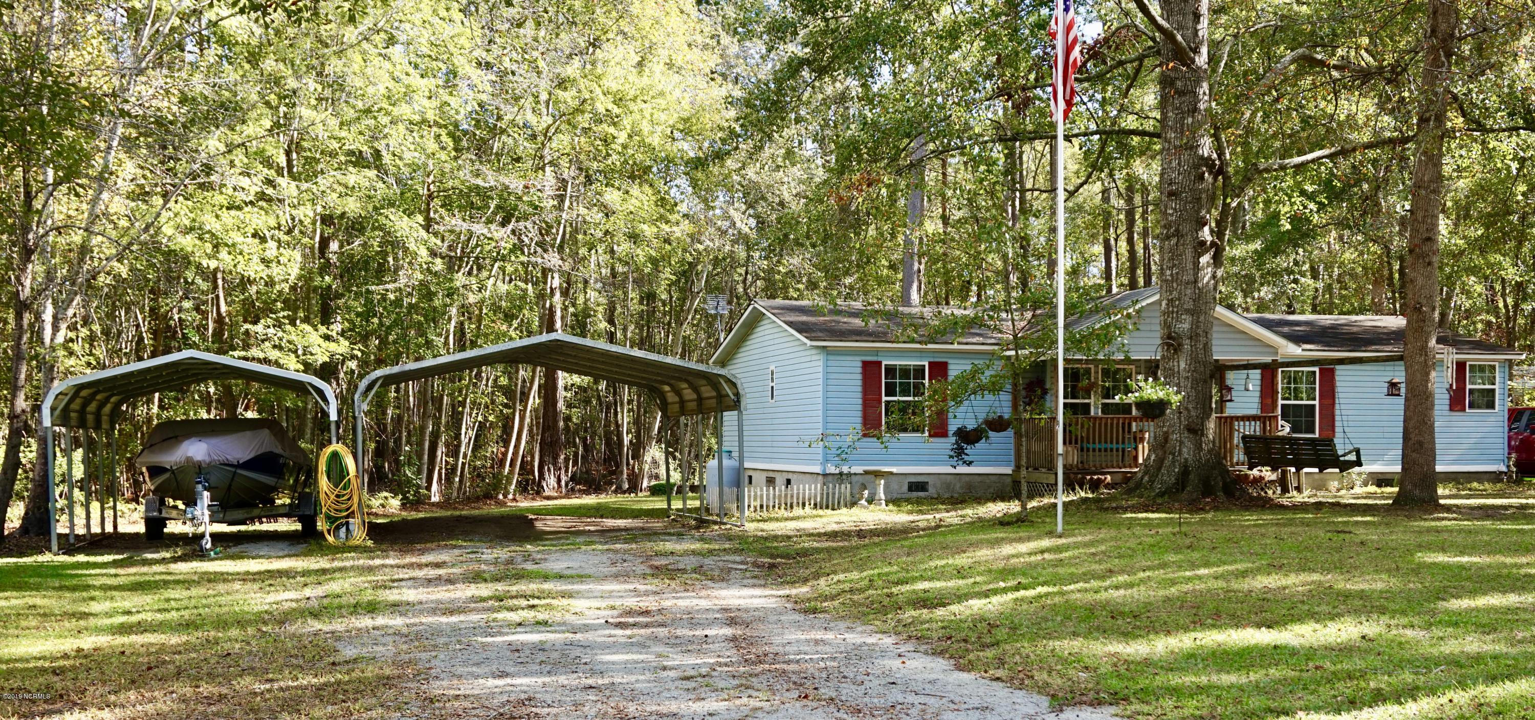 410 Sand Ridge Road New Bern, NC 28560 - Photo 15 of 20 Front Elevation with View of Two Carports