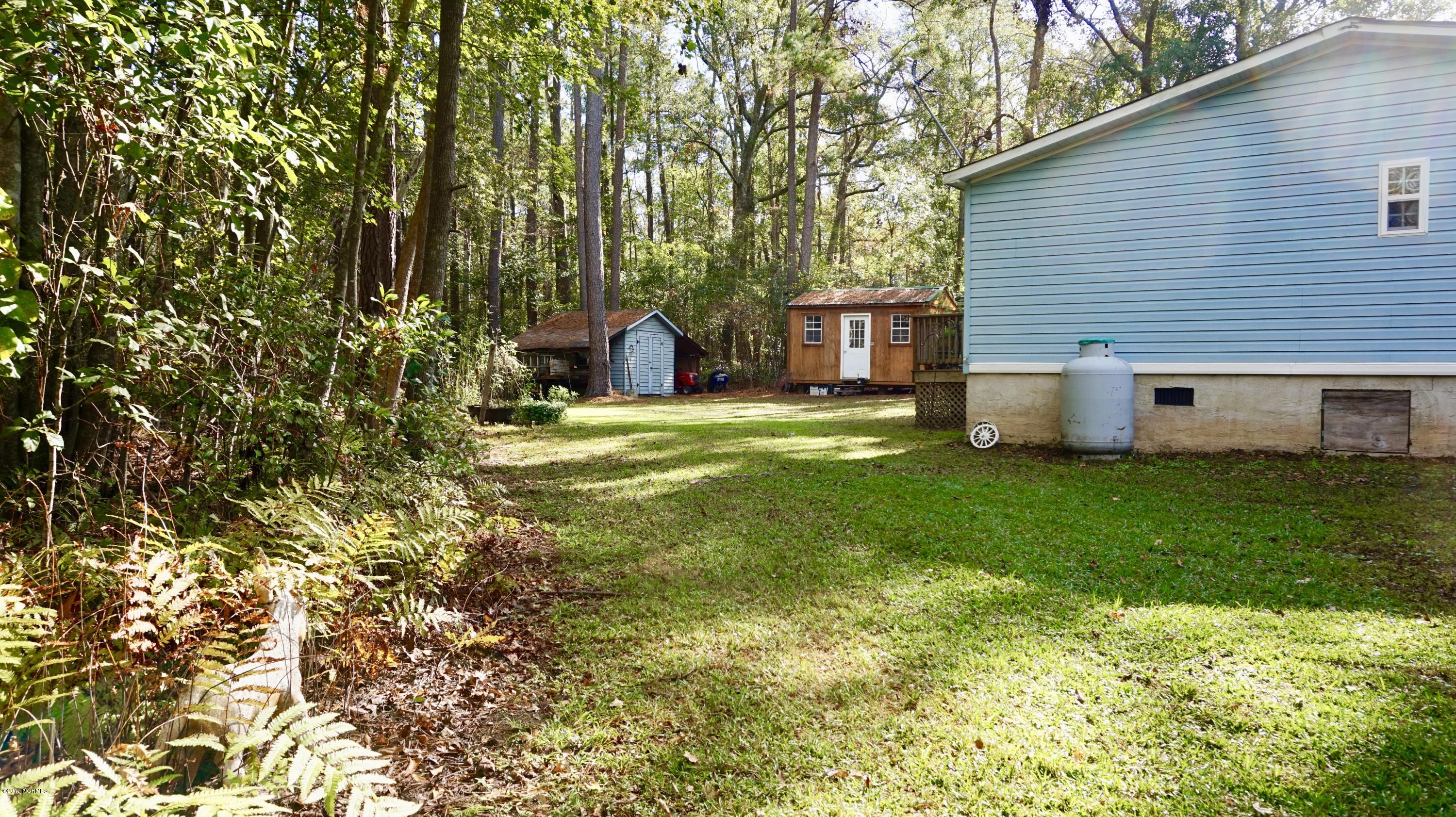 410 Sand Ridge Road New Bern, NC 28560 - Photo 16 of 20 Side Elevation with view of buildings