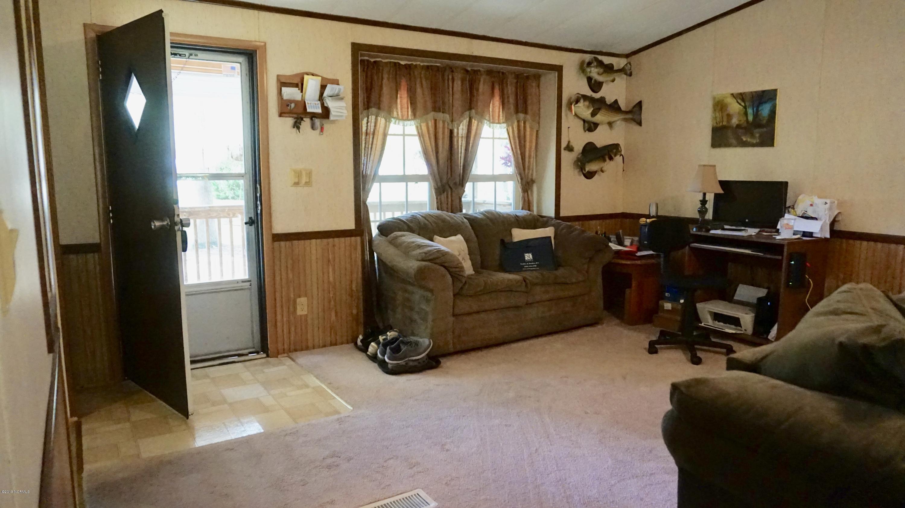 410 Sand Ridge Road New Bern, NC 28560 - Photo 2 of 20 Living Room with Door onto the Front Porch